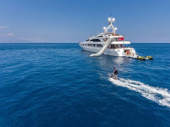 a person surfing in the sea aboard AIR Yacht for Sale