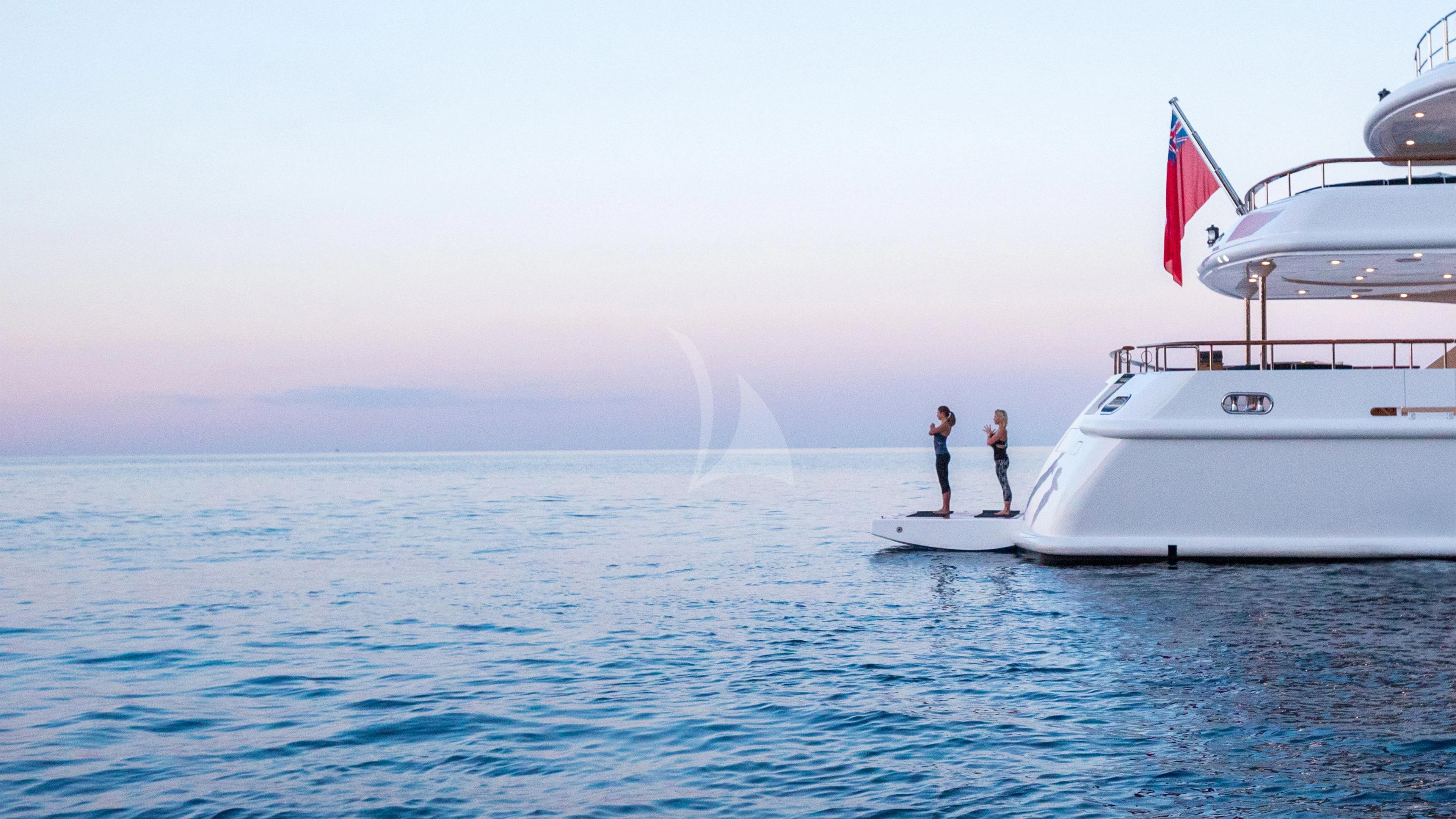 two people standing on a boat aboard AIR Yacht for Sale