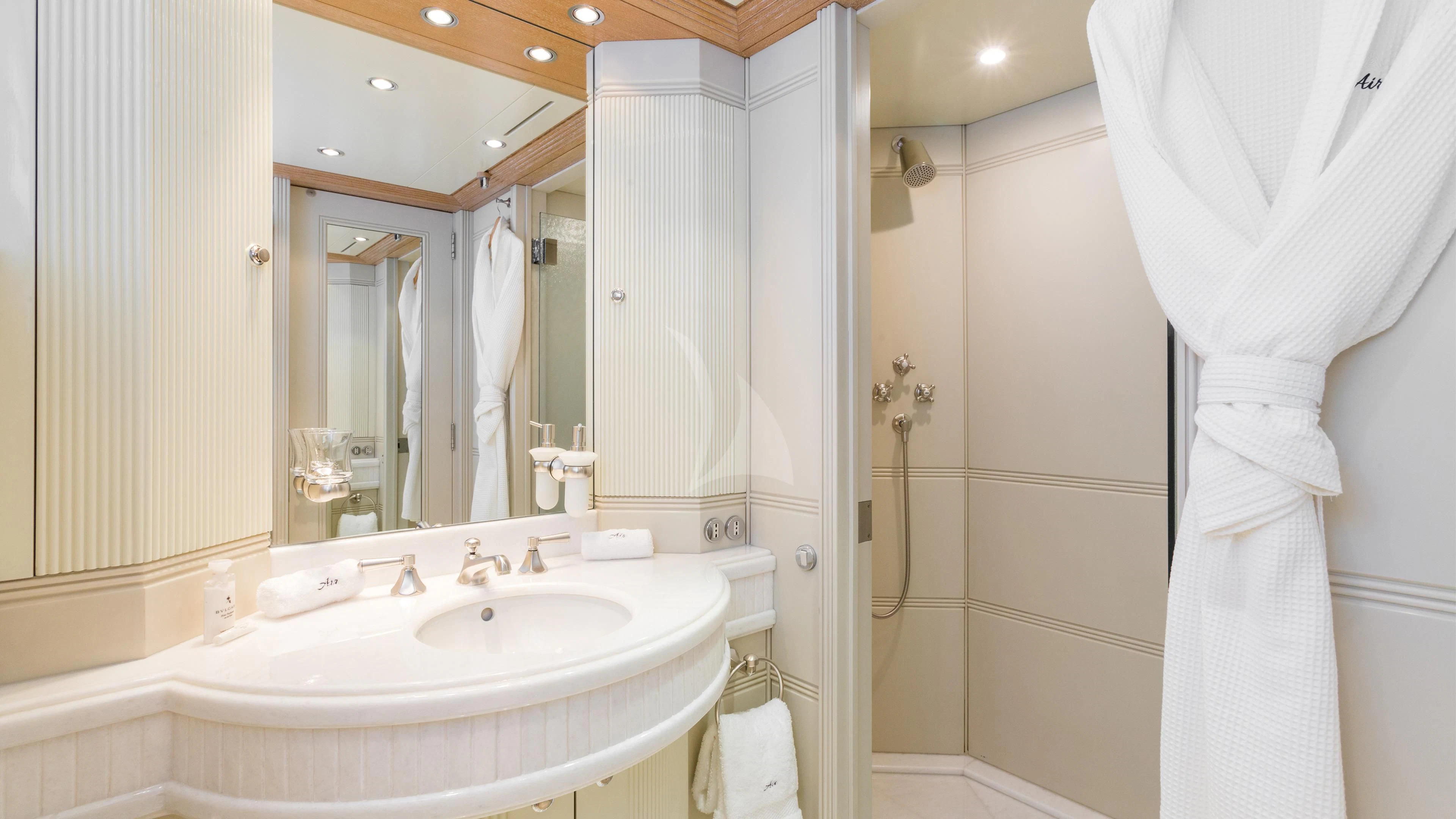 a bathroom with a sink and a mirror aboard AIR Yacht for Sale
