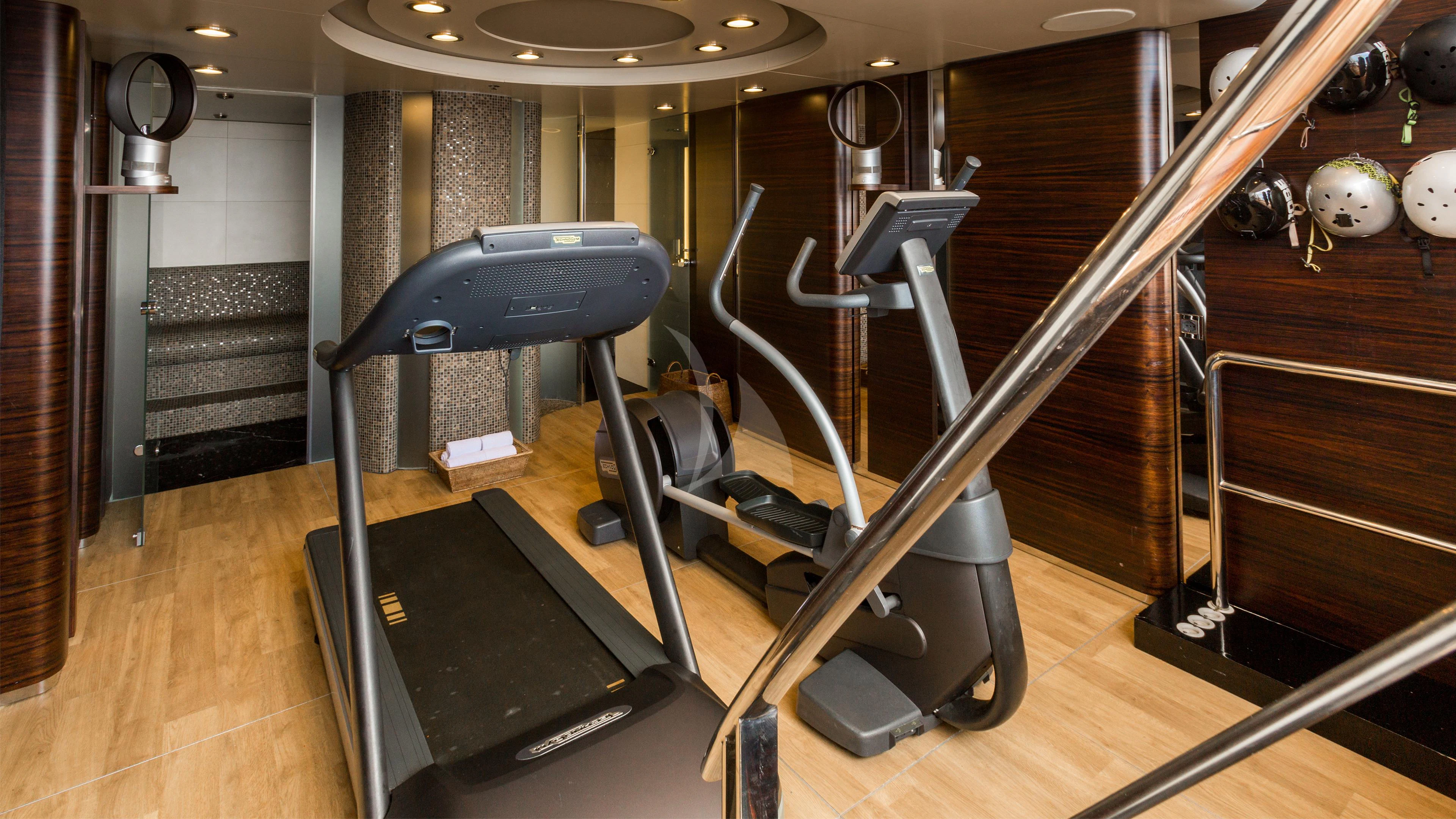 a gym with treadmills aboard AIR Yacht for Sale