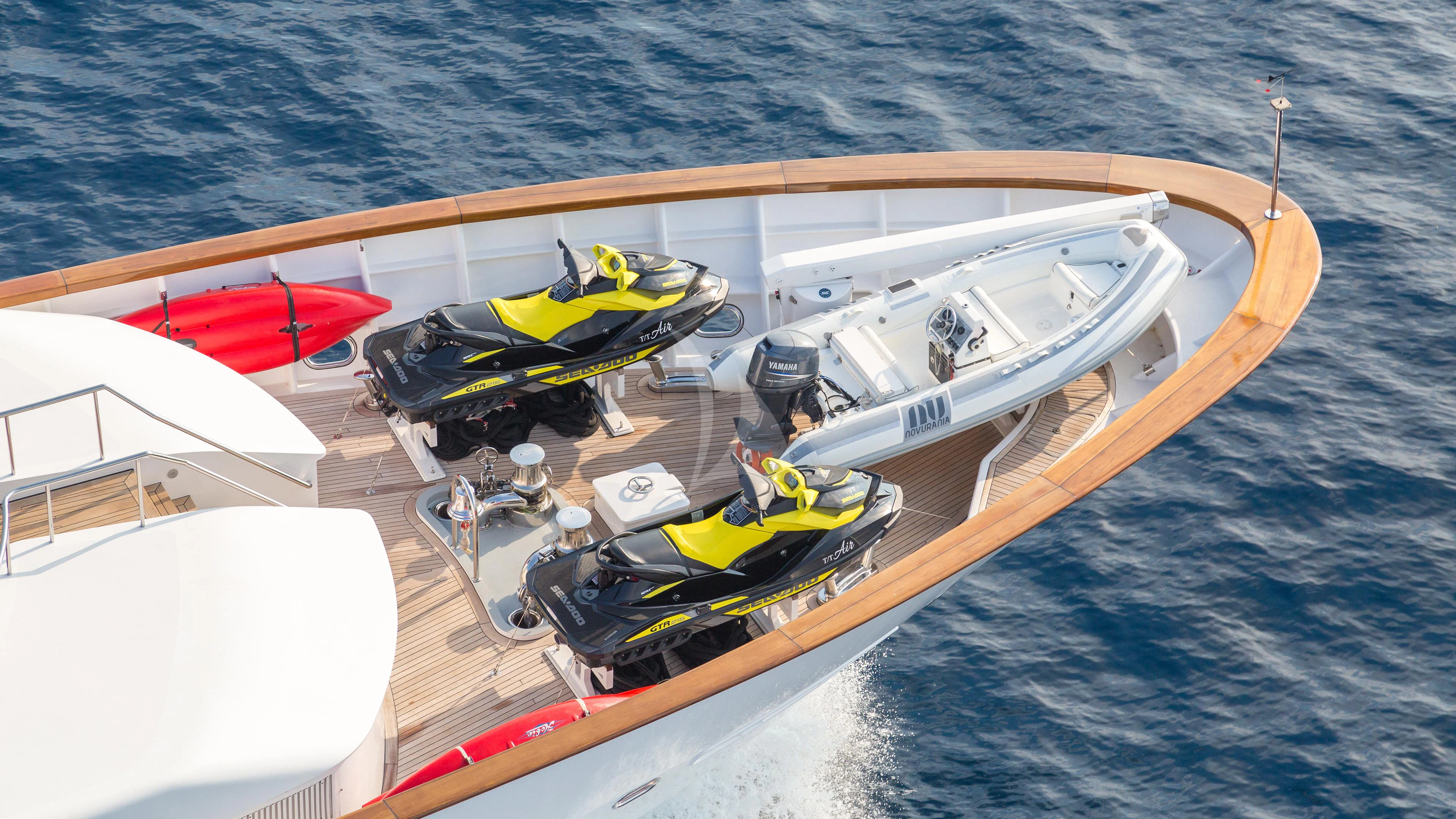 a boat with a motor attached to it aboard AIR Yacht for Sale