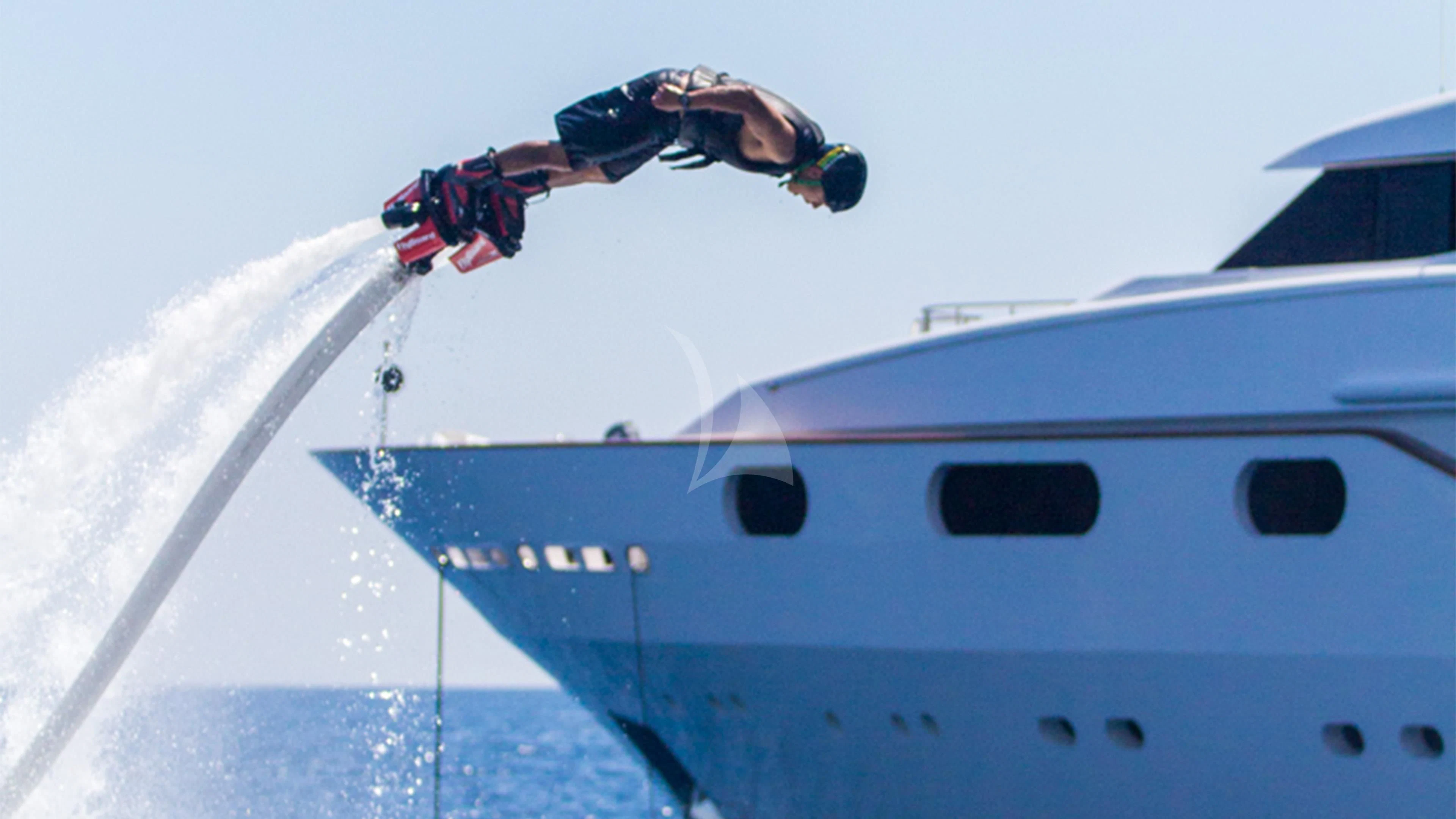 a person jumping over a boat aboard AIR Yacht for Sale