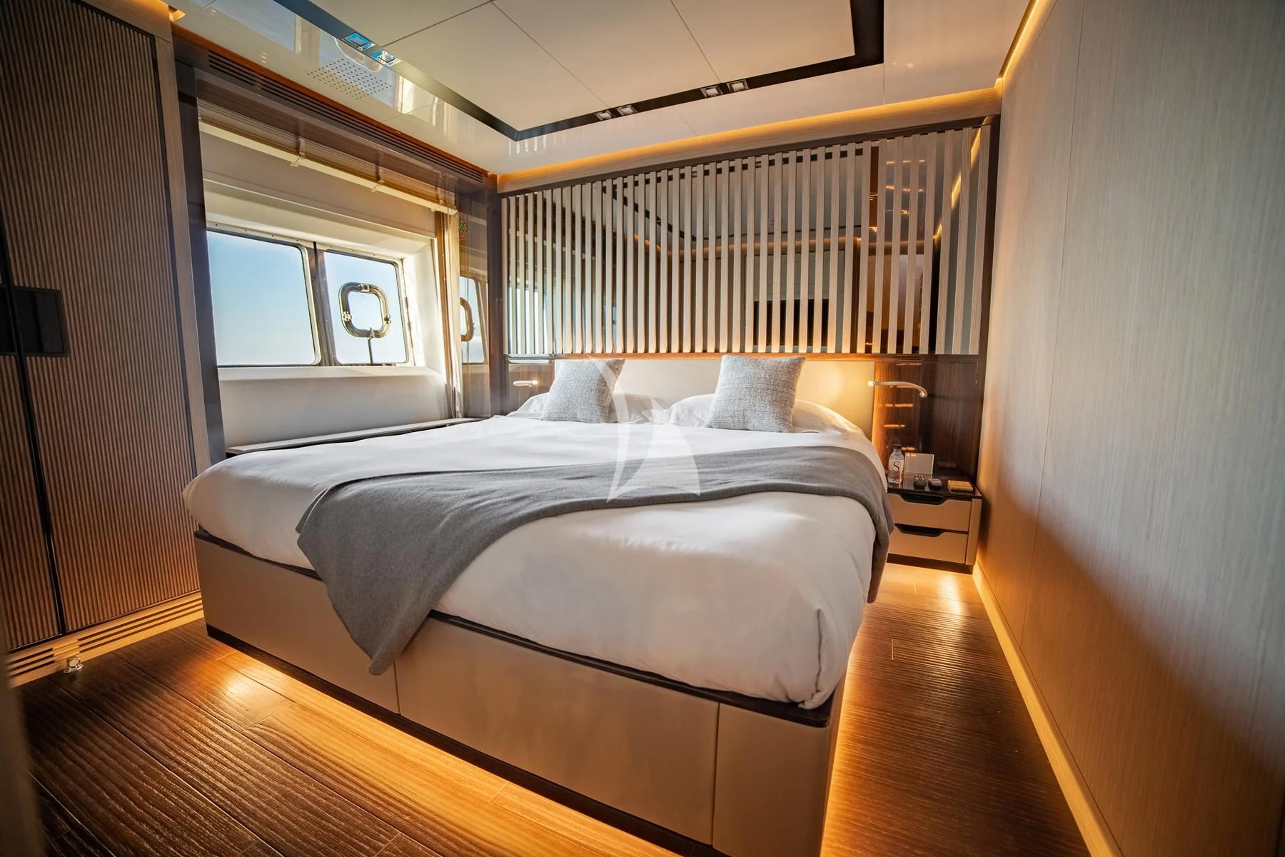 a bed with a white sheet aboard EDEN Yacht for Sale