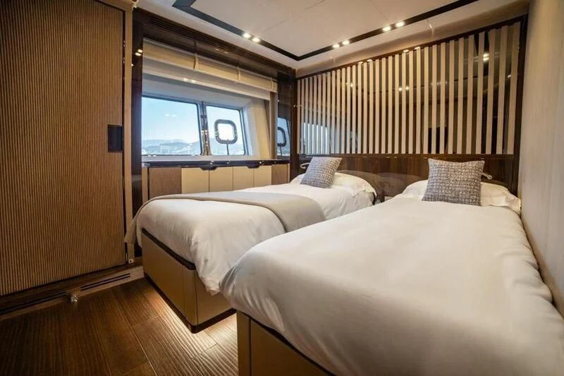a room with two beds aboard EDEN Yacht for Sale