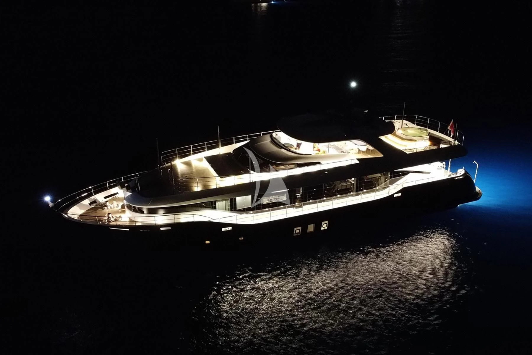 a black and white boat on the water aboard EDEN Yacht for Sale