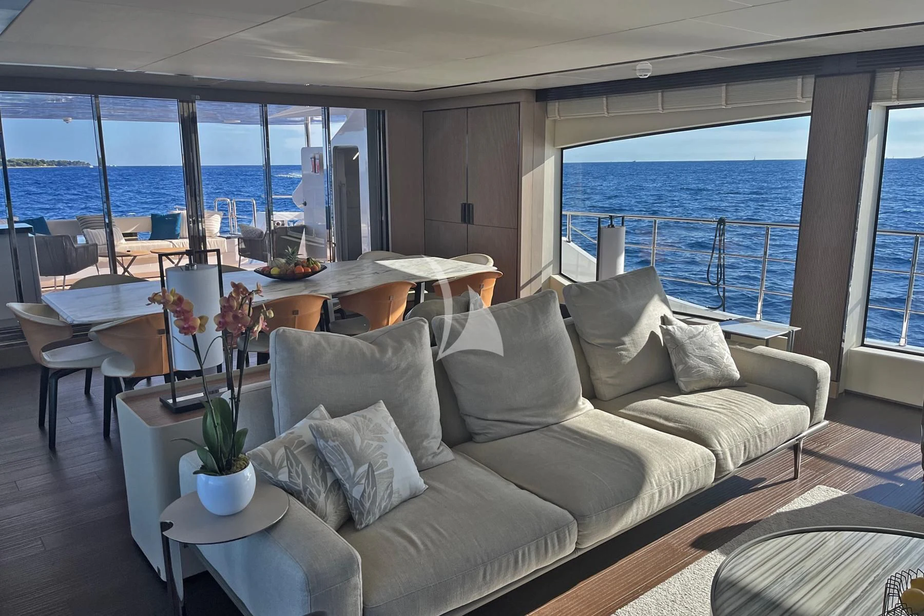 a living room with a couch and a table aboard EDEN Yacht for Sale