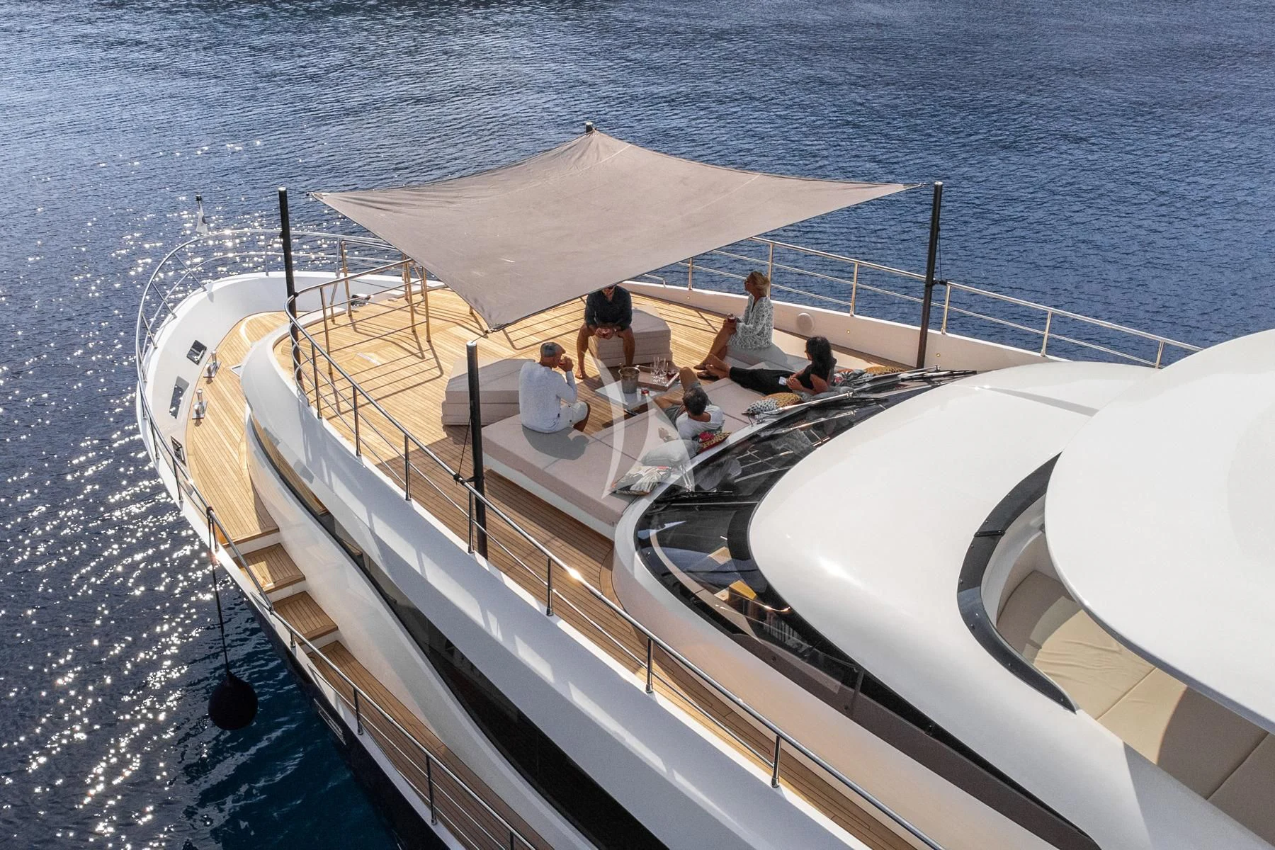 a group of people sitting on a boat in the water aboard EDEN Yacht for Sale
