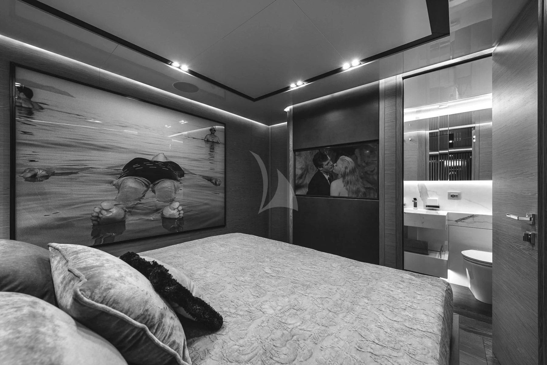 a bedroom with a bed and a mirror aboard EDEN Yacht for Sale