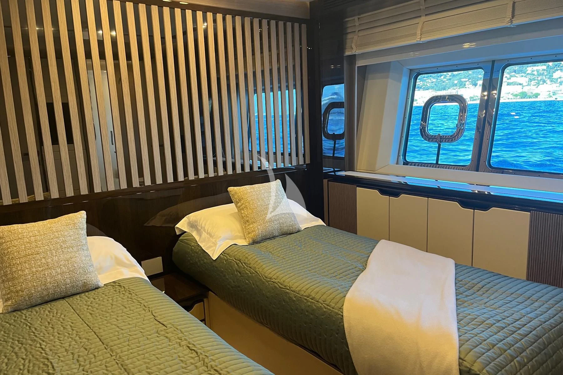 a room with a bed and a window aboard EDEN Yacht for Sale