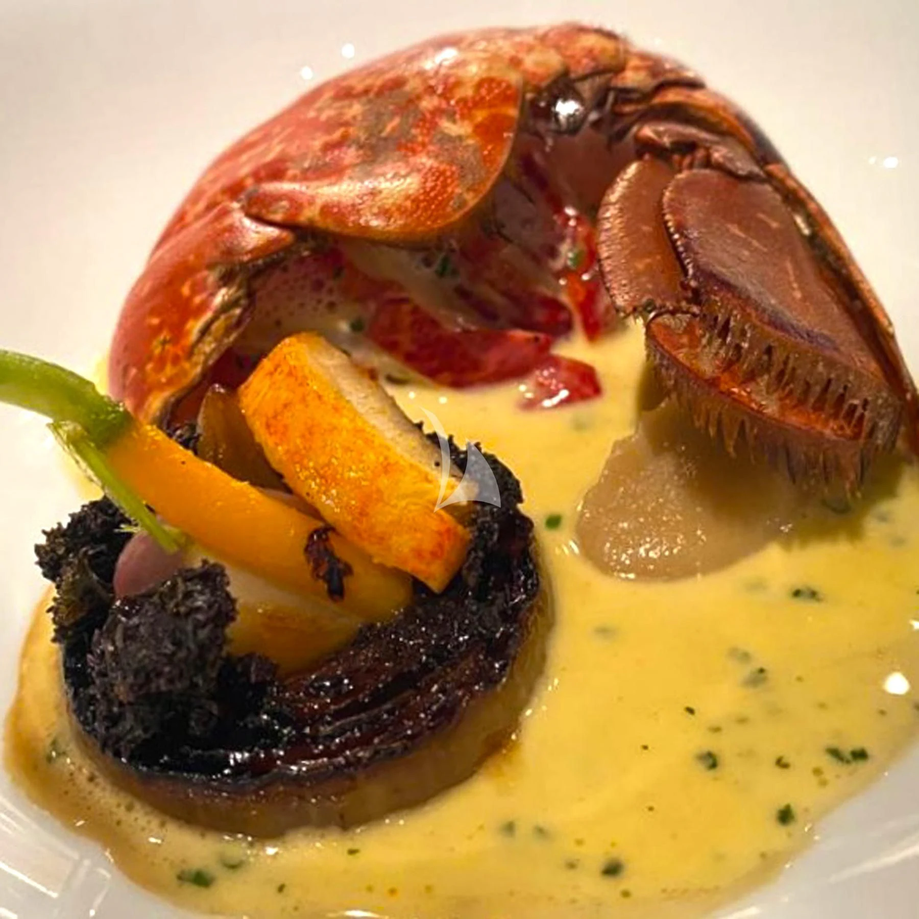 a plate of food aboard EDEN Yacht for Sale