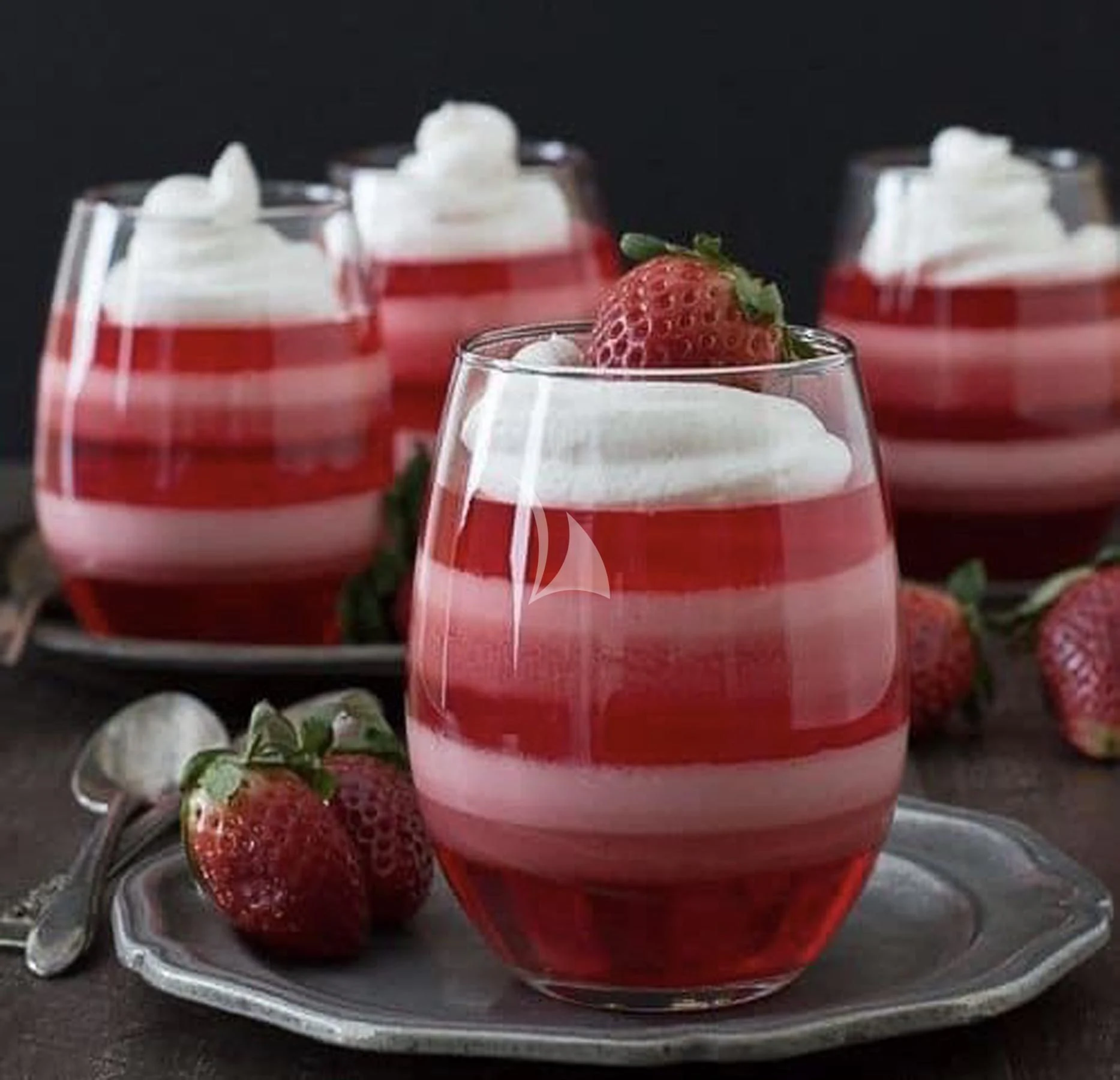 a group of red and white desserts on a silver platter aboard EDEN Yacht for Sale