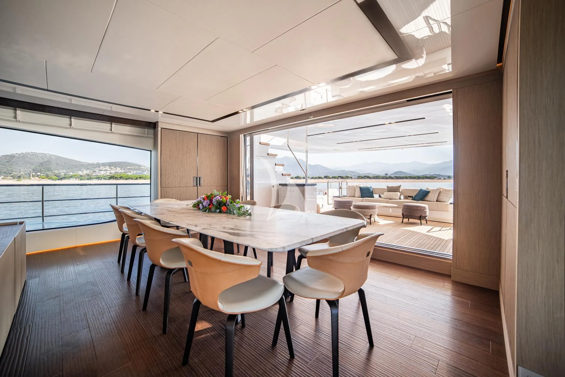a room with a table and chairs aboard EDEN Yacht for Sale