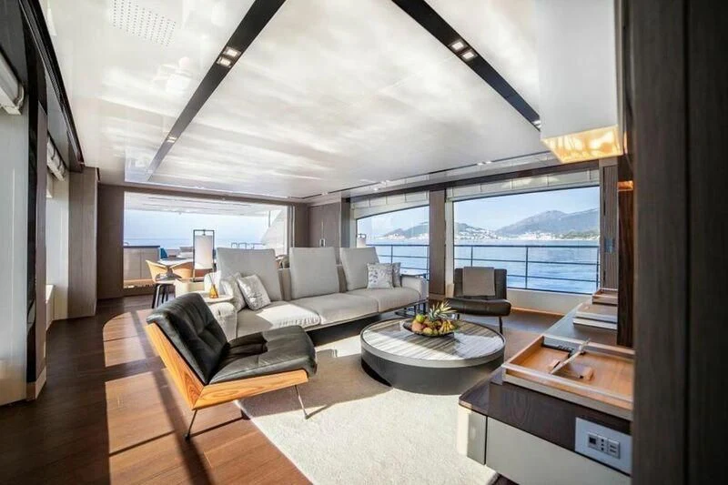 a living room with a large window aboard EDEN Yacht for Sale