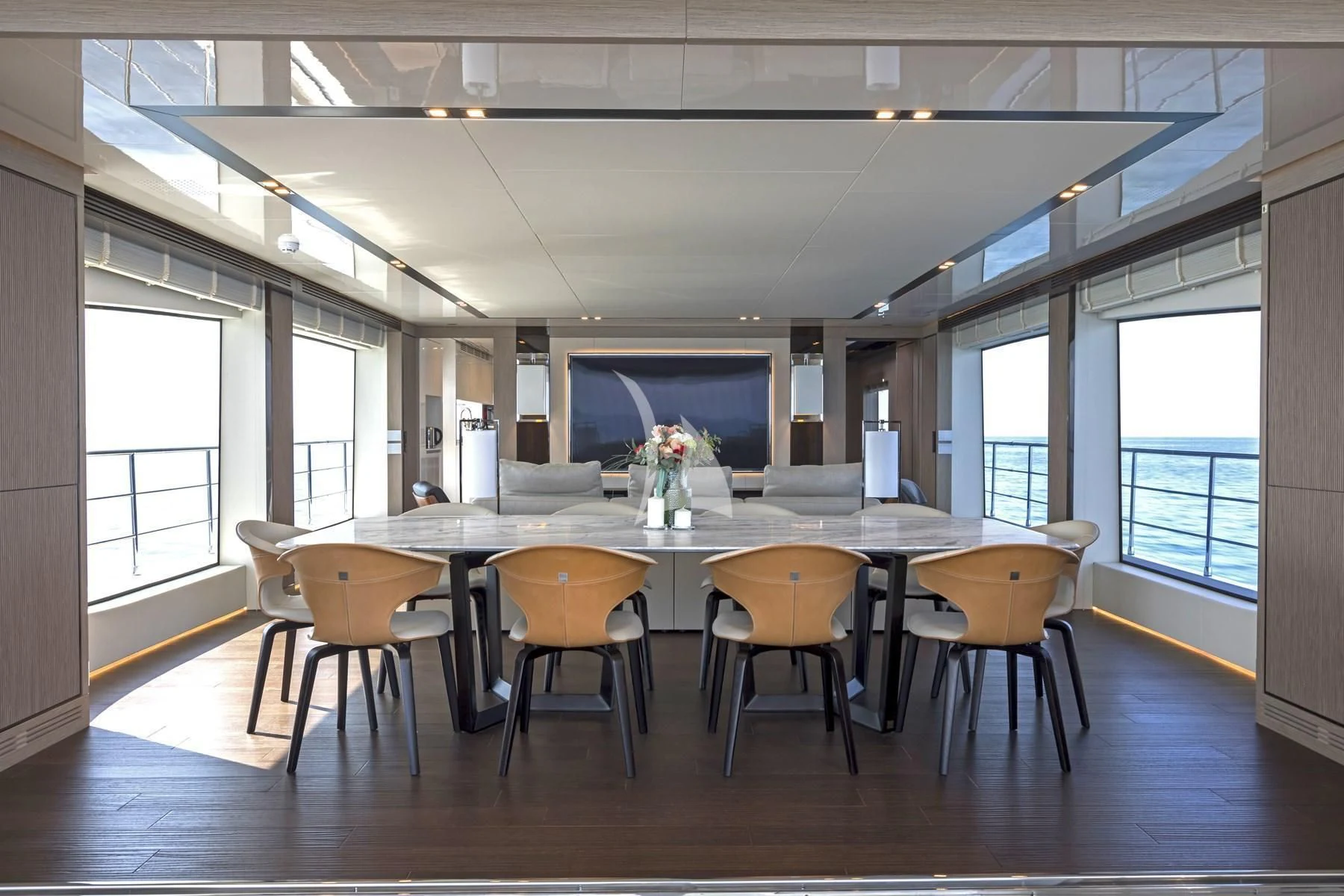 a room with a table and chairs aboard EDEN Yacht for Sale