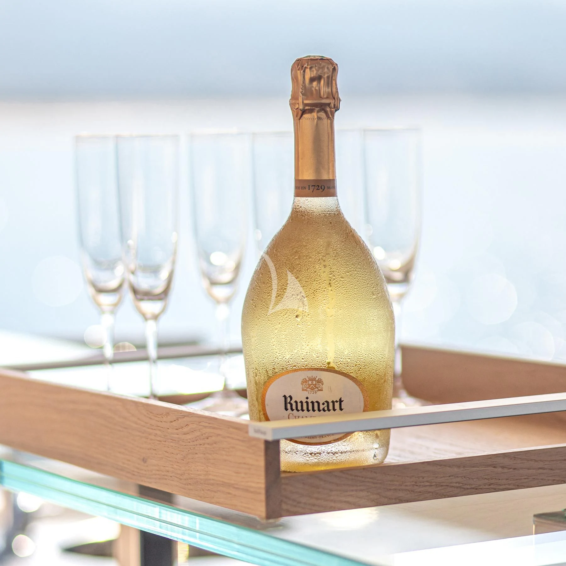 a bottle of champagne on a shelf aboard EDEN Yacht for Sale