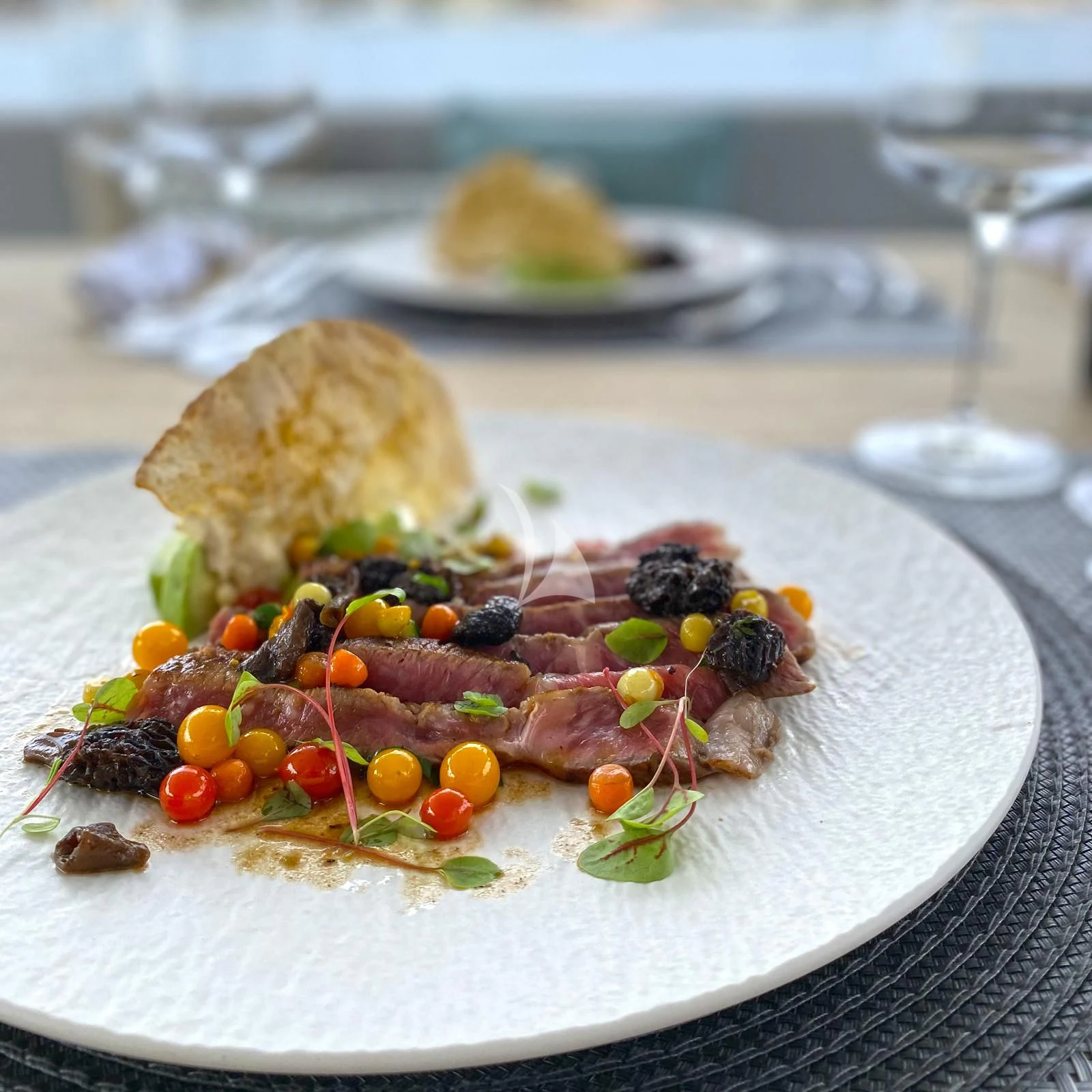 a plate of food aboard EDEN Yacht for Sale