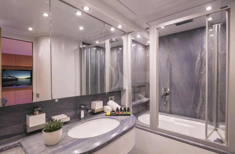 a bathroom with a large mirror aboard ANASA Yacht for Sale