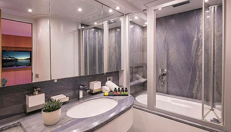 a bathroom with a large glass shower aboard ANASA Yacht for Sale