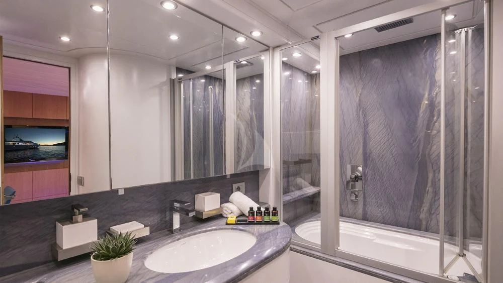 a bathroom with a large mirror aboard ANASA Yacht for Sale