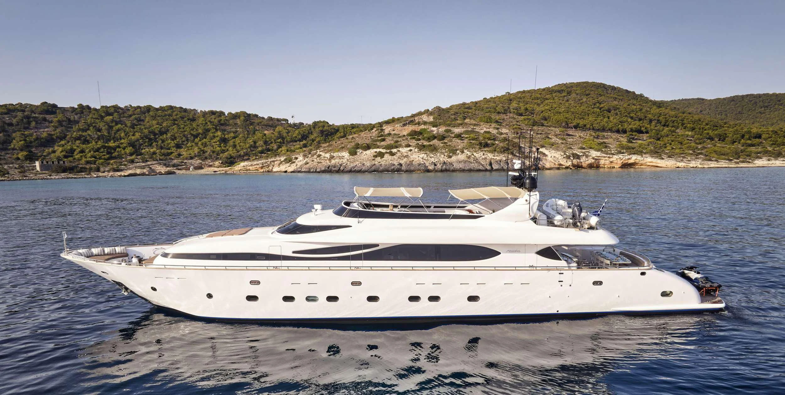 a white yacht on the water aboard ANASA Yacht for Sale