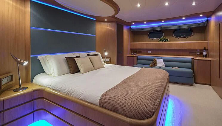 a room with a bed and a desk aboard ANASA Yacht for Sale