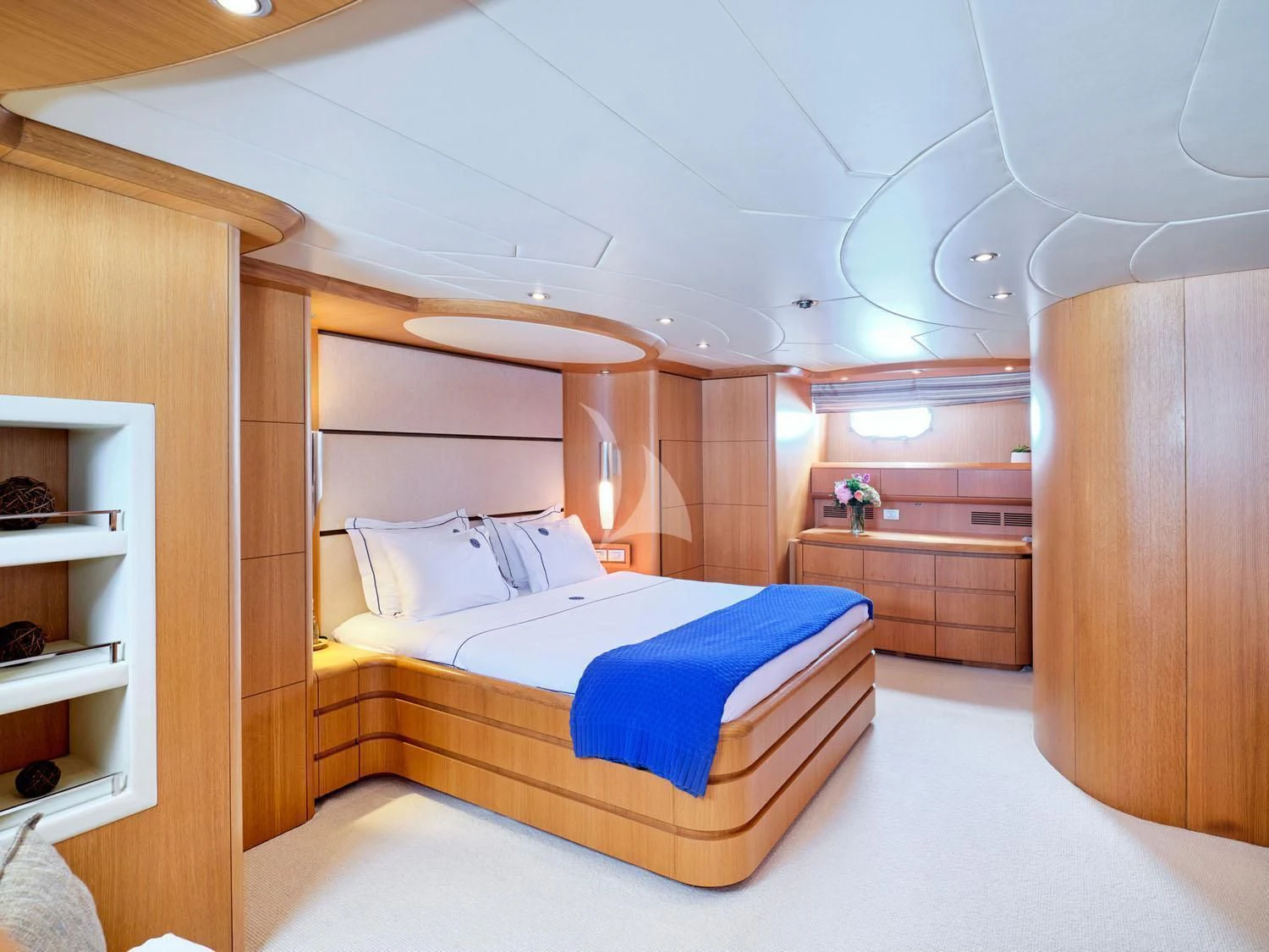 a bedroom with a bed and a closet aboard ANASA Yacht for Sale
