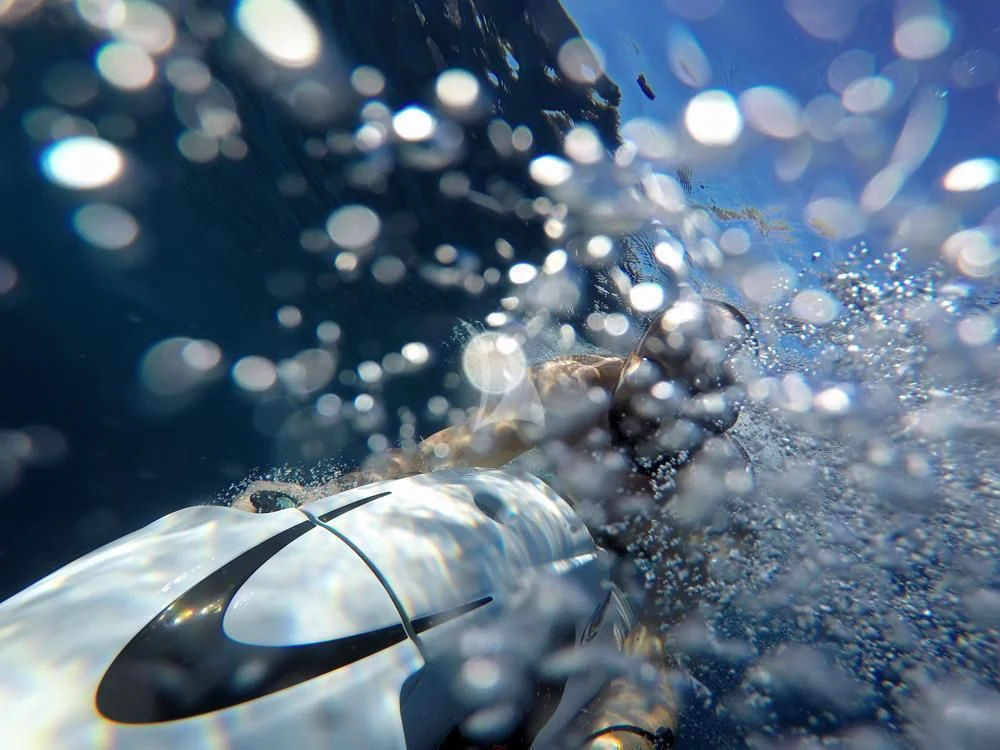 a pair of sunglasses on a blue surface aboard ANASA Yacht for Sale