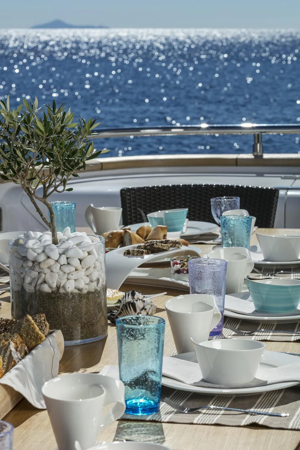 a table with food and drinks on it aboard ANASA Yacht for Sale