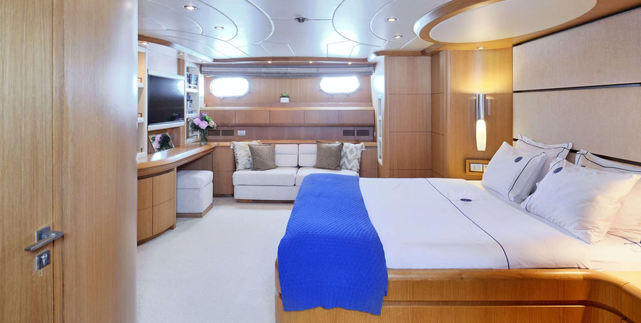 a room with a bed and a couch aboard ANASA Yacht for Sale