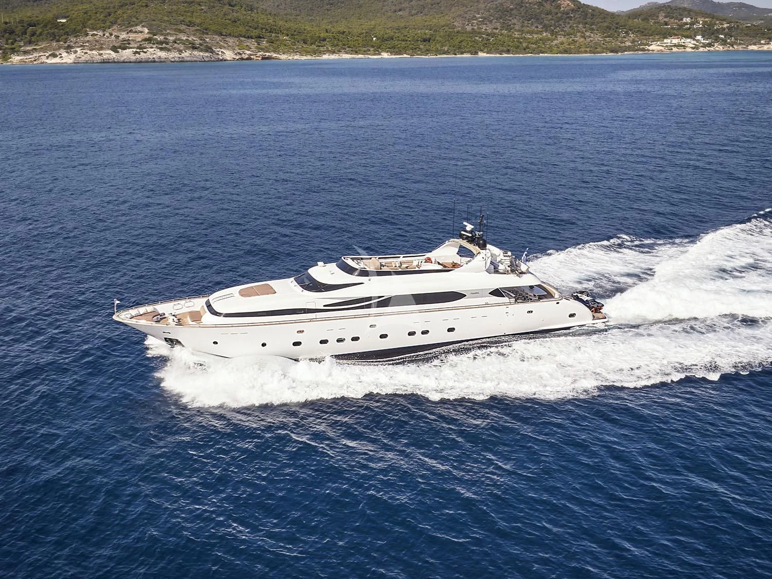 a white yacht on the water aboard ANASA Yacht for Sale