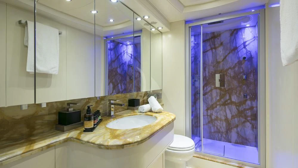a bathroom with a large mirror aboard ANASA Yacht for Sale
