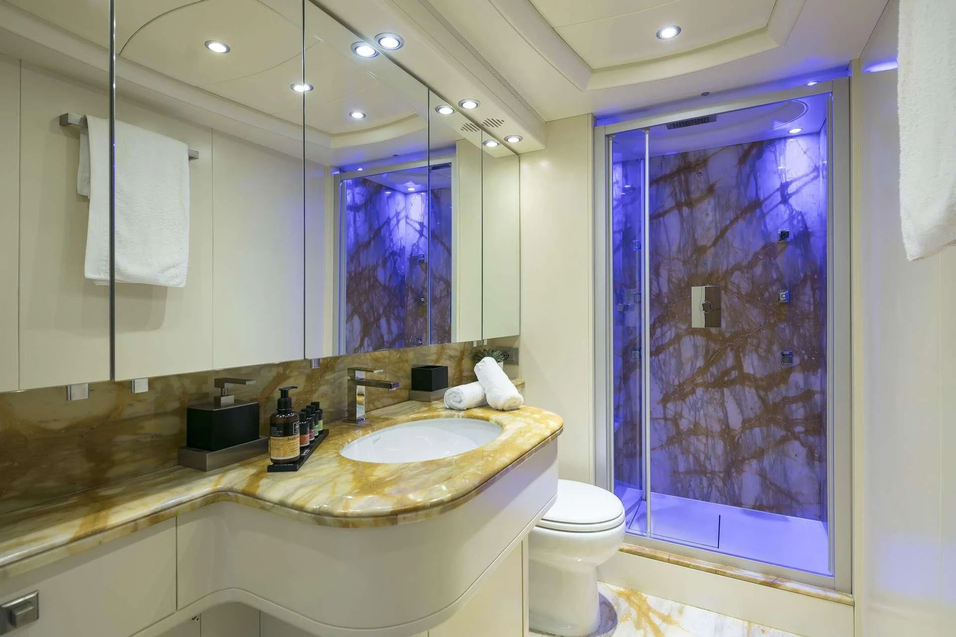 a bathroom with a large mirror aboard ANASA Yacht for Sale