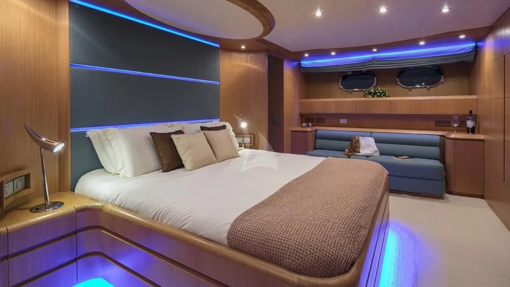 a room with a bed and a desk aboard ANASA Yacht for Sale