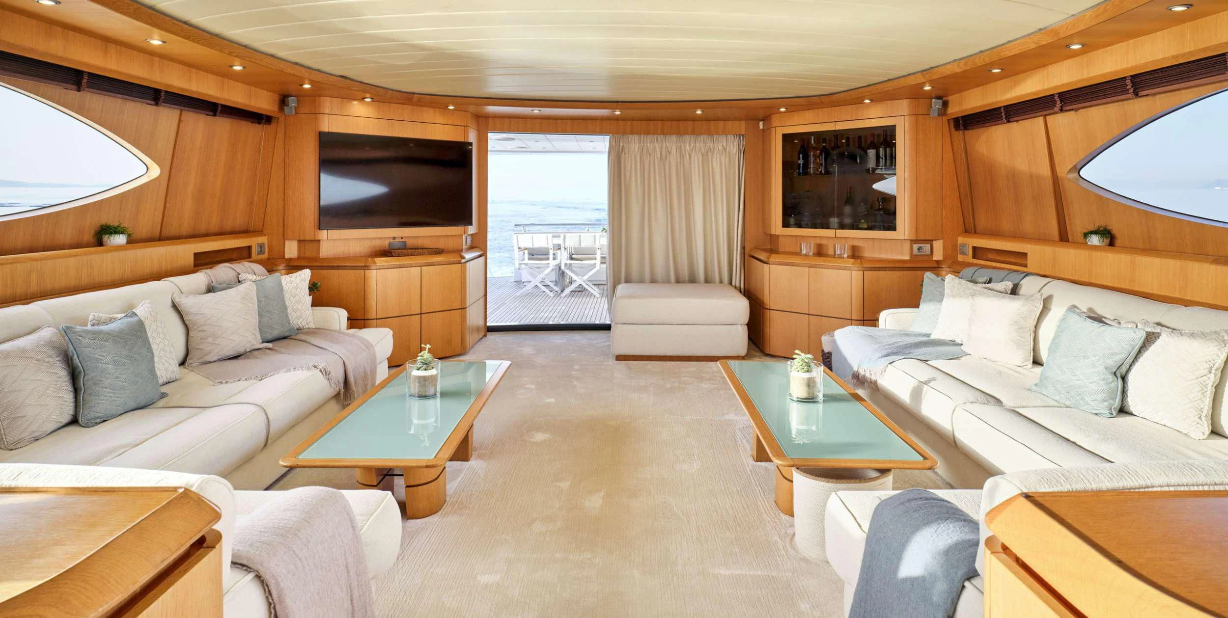 a living room with a couch and a coffee table aboard ANASA Yacht for Sale