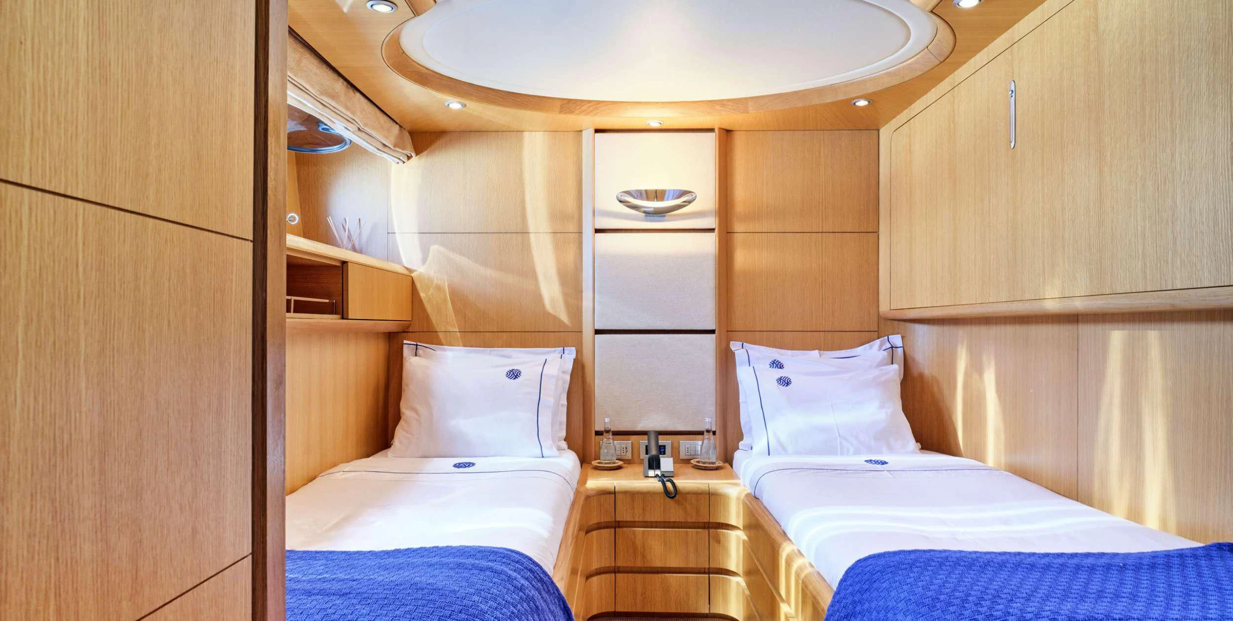a room with two beds aboard ANASA Yacht for Sale