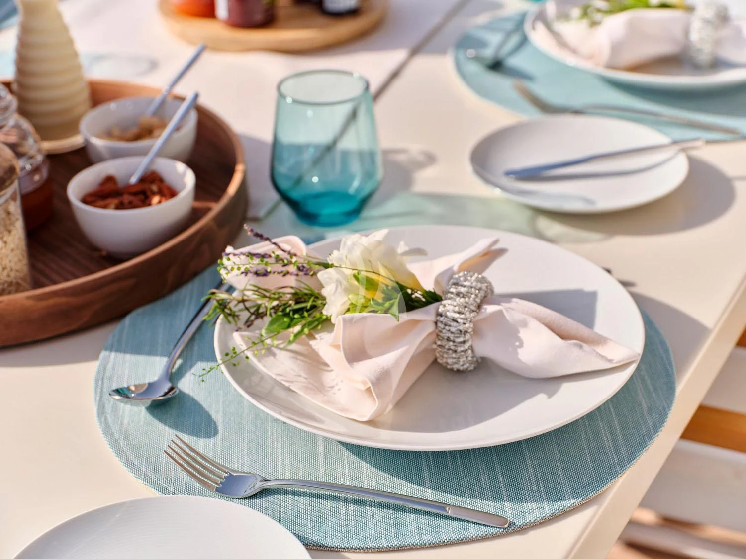 a table with plates and bowls of food on it aboard ANASA Yacht for Sale