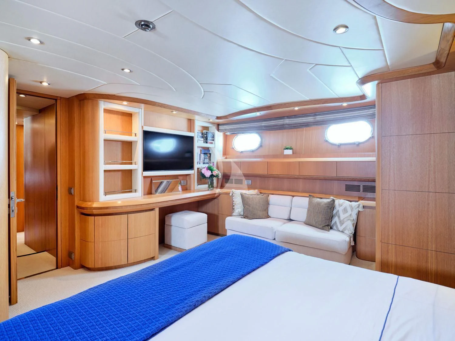 a room with a bed and a tv aboard ANASA Yacht for Sale