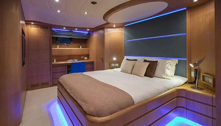 a room with a bed and a desk aboard ANASA Yacht for Sale