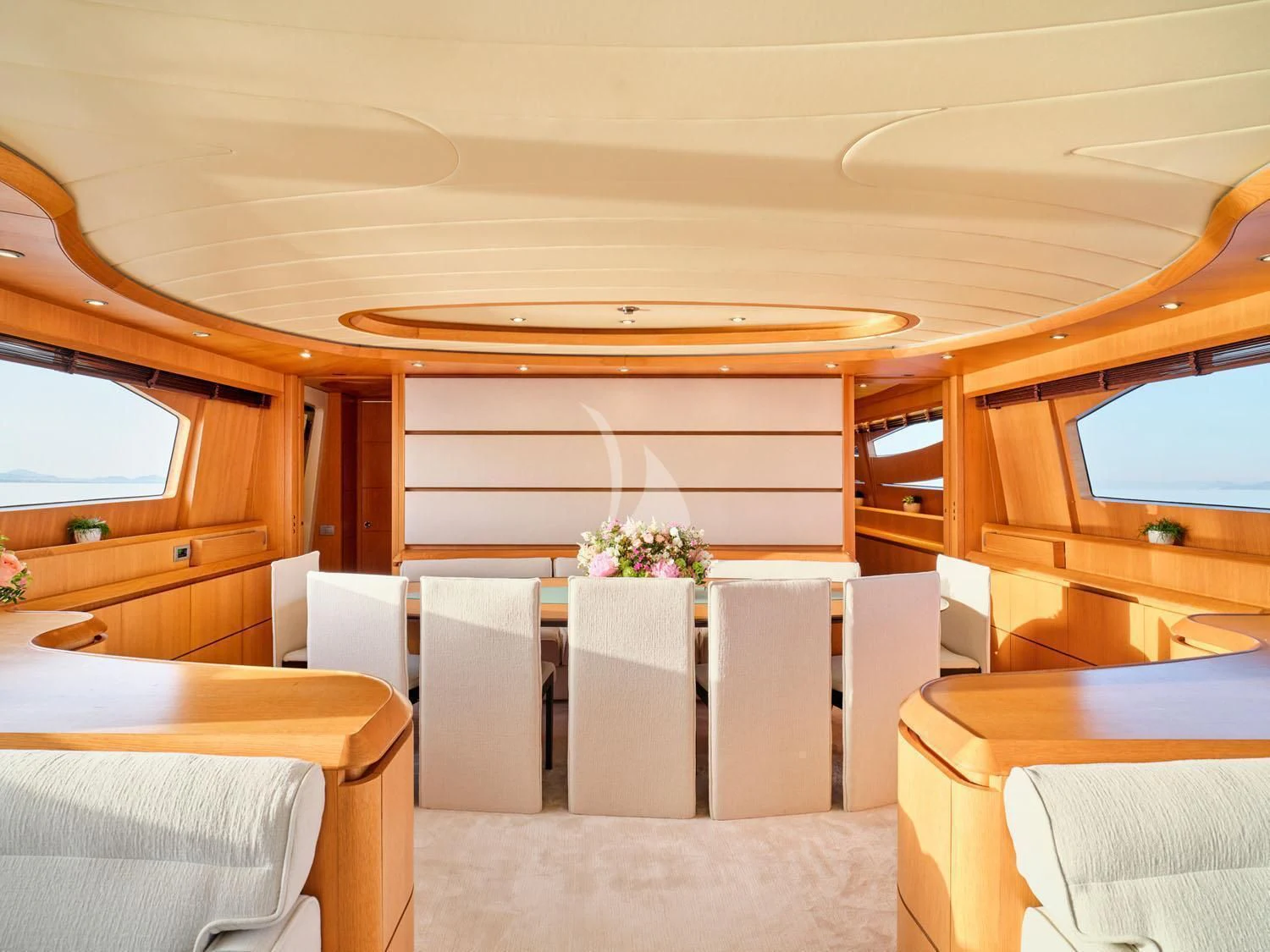 a room with tables and chairs aboard ANASA Yacht for Sale