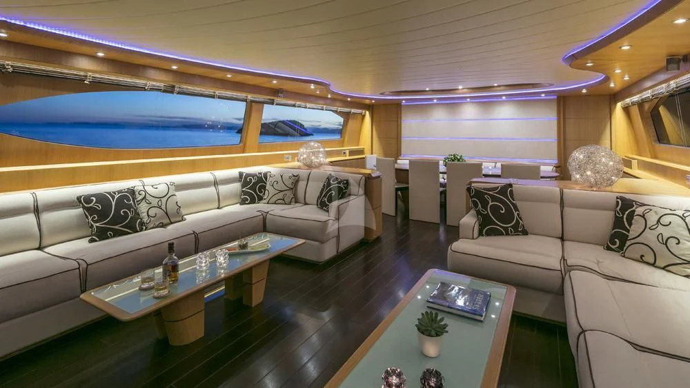 a living room with a large window aboard ANASA Yacht for Sale