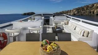 a room with a table and chairs aboard ANASA Yacht for Sale