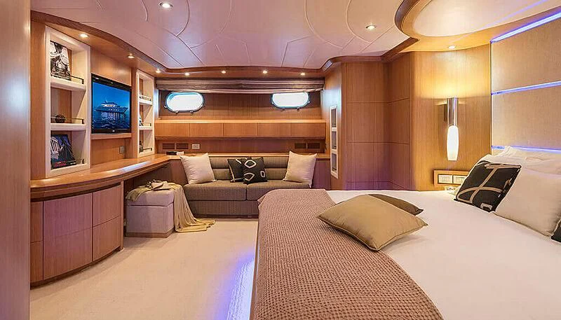 a room with a bed and a television aboard ANASA Yacht for Sale