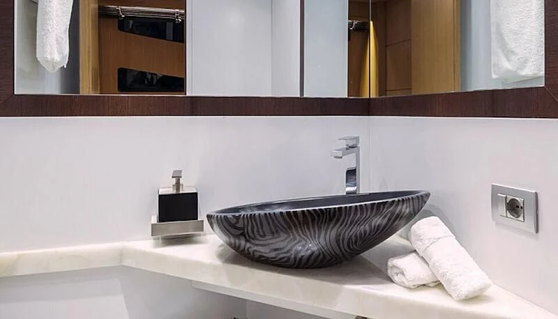 a bathroom sink with a mirror above it aboard ANASA Yacht for Sale