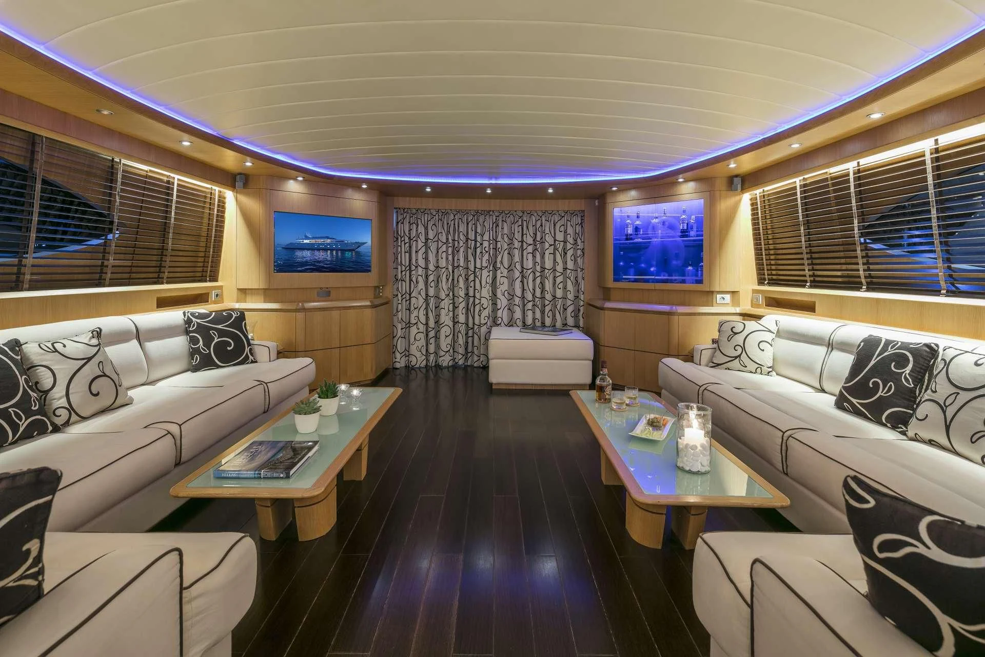 a room with a couch and a table and a television aboard ANASA Yacht for Sale