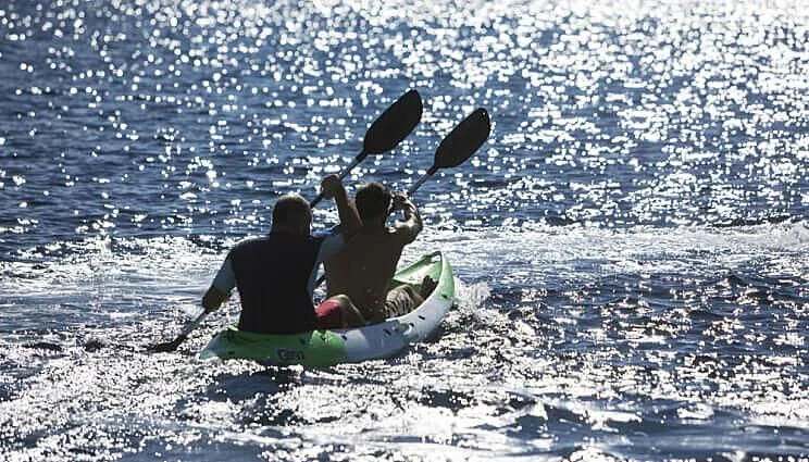 a group of people on a sled with a shark and a shark aboard ANASA Yacht for Sale