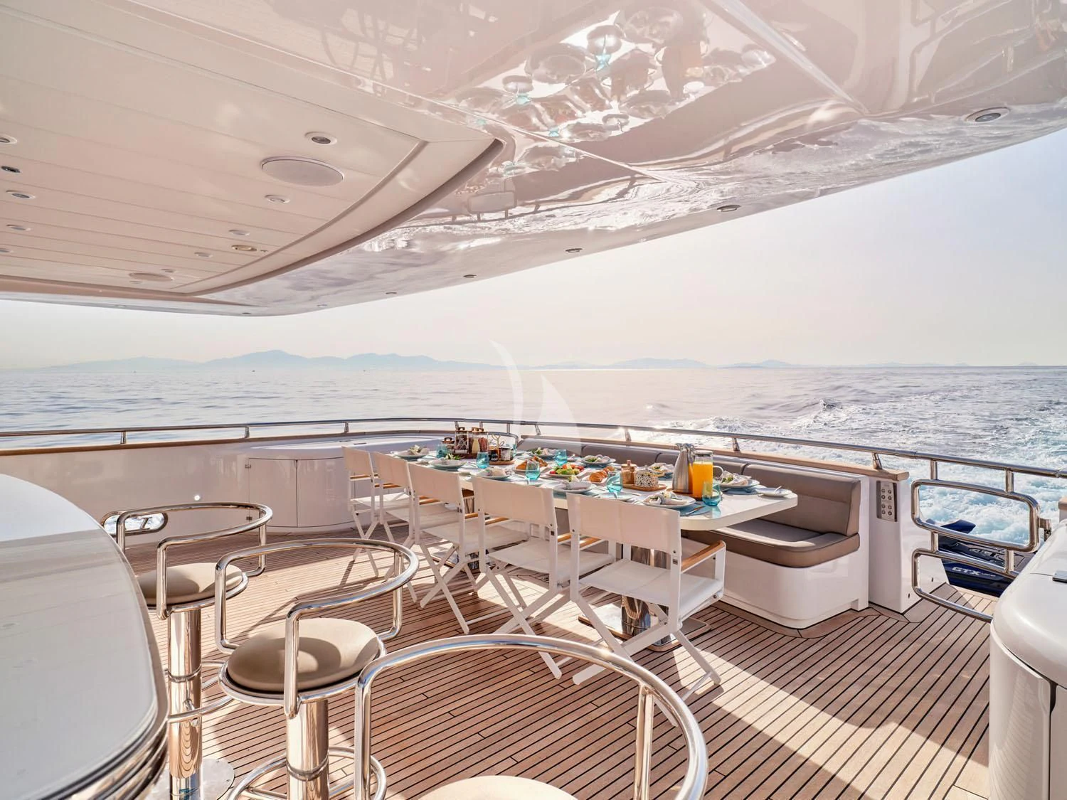 a room with a table and chairs aboard ANASA Yacht for Sale