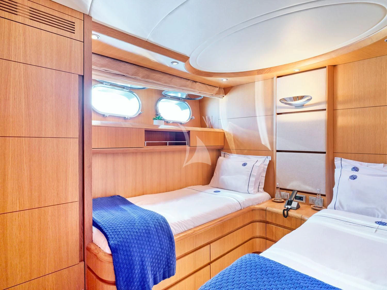 a room with a bed and a dresser aboard ANASA Yacht for Sale