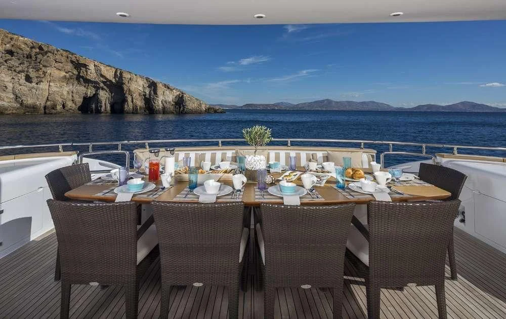 a table set for a meal on a boat aboard ANASA Yacht for Sale