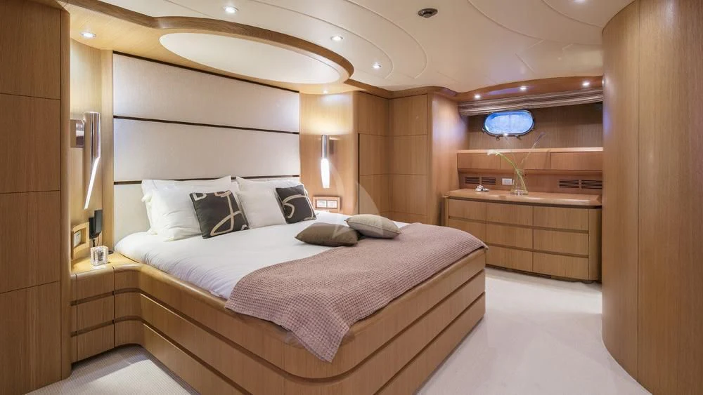 a room with a bed and a desk aboard ANASA Yacht for Sale