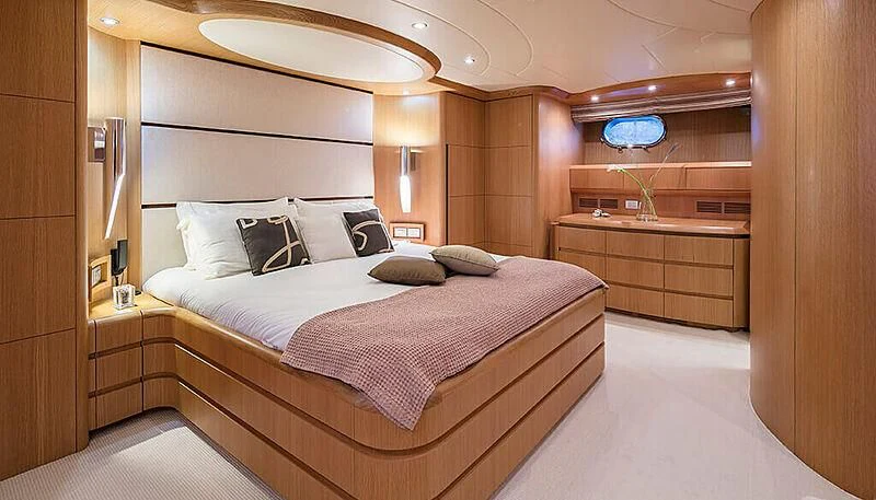 a large bed in a room aboard ANASA Yacht for Sale